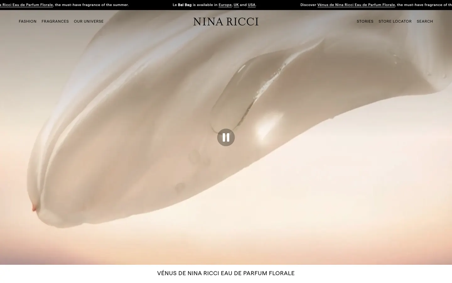 The top of the Nina Ricci homepage on desktop: a soft, cream-toned fragrance film filling the fold under the Nina Ricci navigation